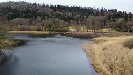 Cinematic-aerial-footage-of-Fell-Foot-on-Lake-Windermere-a-Lakeshore-park-with-stunning-views-of-the-Cumbrian-mountains