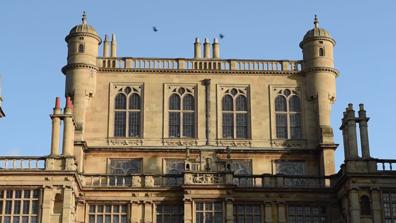 View of Wollaton Hall located in Wollaton Park, Nottingham, England. This magnificent mansion is one of Nottingham’s most famous historic landmarks, surrounded by lush parkland, gardens, and deer