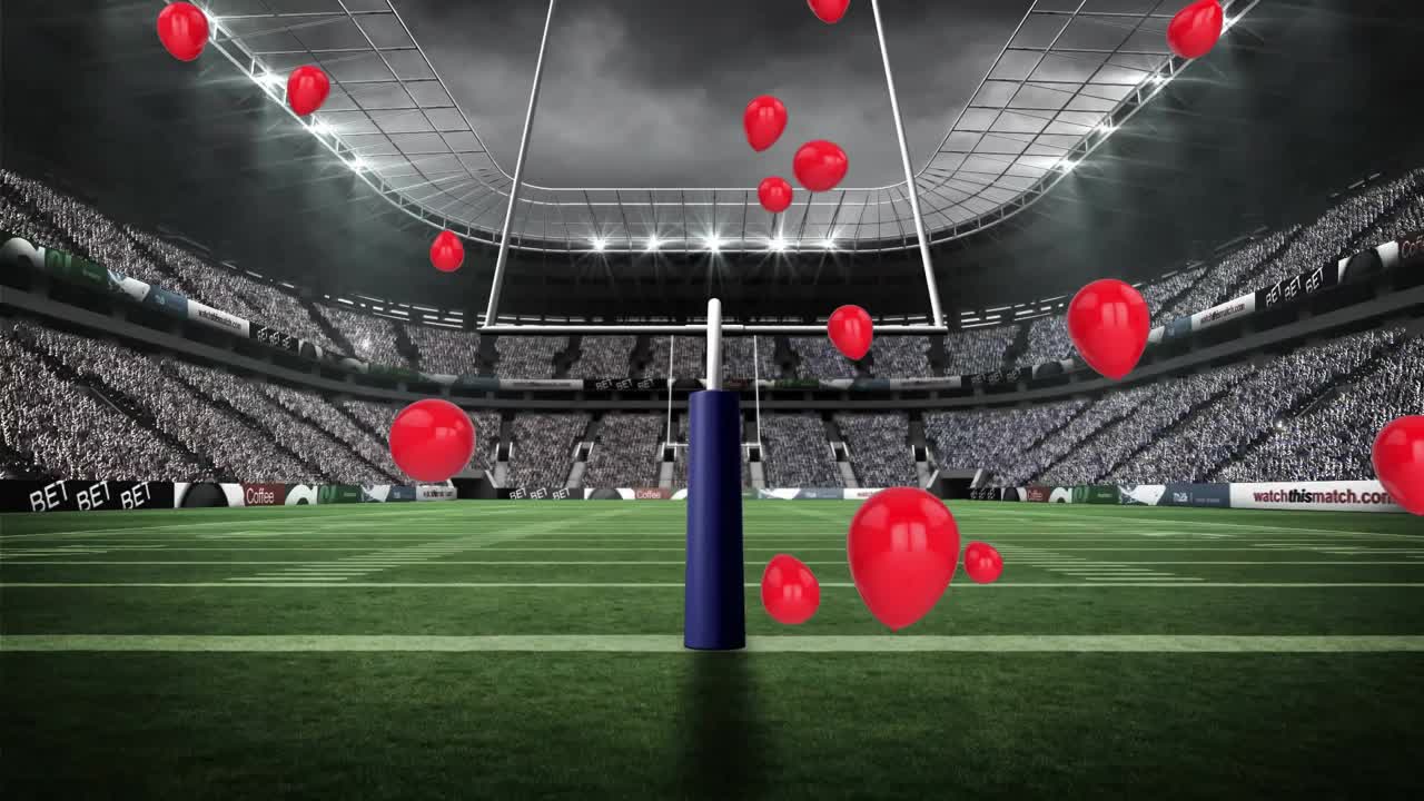 Red balloons rising around goalpost after single balloon drifting up, creating festive sports scene