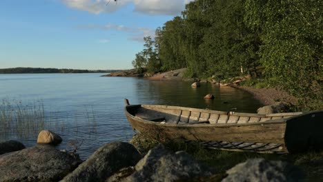 picturesque sea bay calm water wooden boat in summer