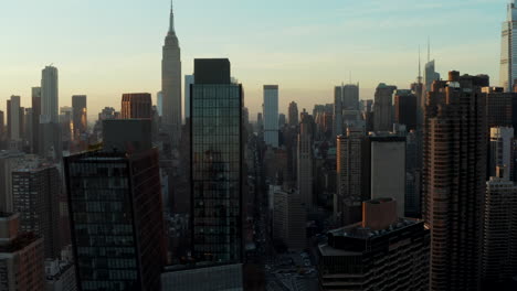 Elevated-view-of-various-high-rise-buildings-in-city-at-dusk.-Skyscrapers-against-colourful-sky.-Manhattan,-New-York-City,-USA