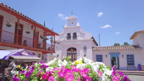 steady 4k shot of flowers and church in pueblito paisa, cerro nutibara