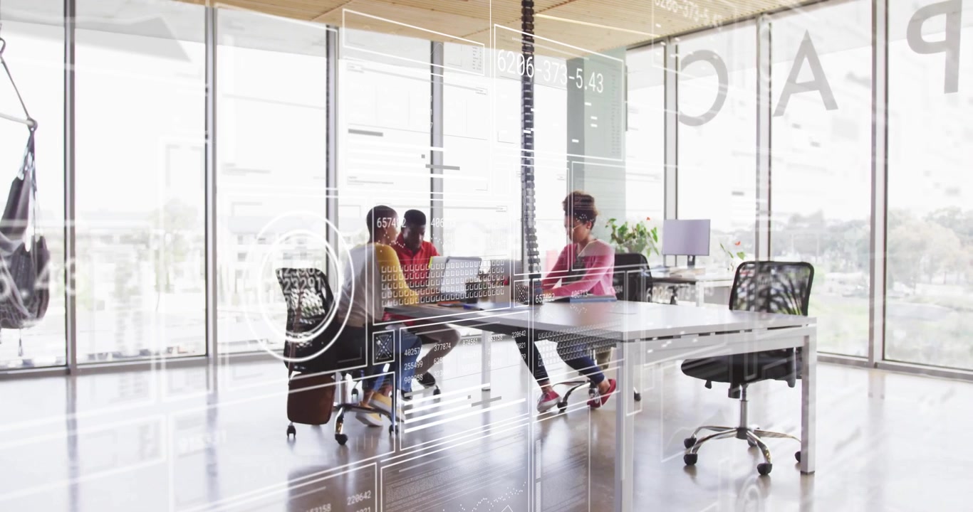 Three coworkers typing on laptops as data overlay animating, facilitating business analysis