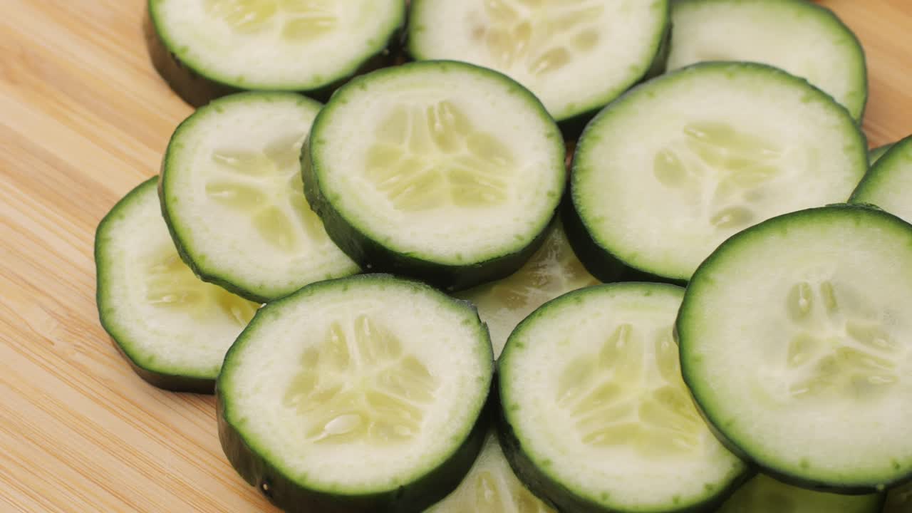 Slicing cucumber vegetables with a knife for cooking, chef cut vegetable.