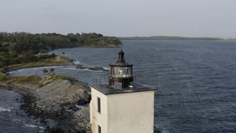 bird roosting on lighthouse in rhode island aerial