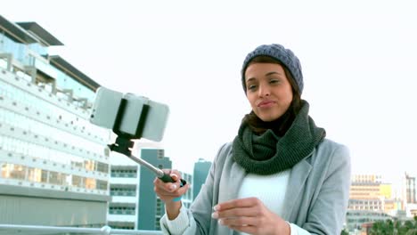 hipster taking a selfie outside