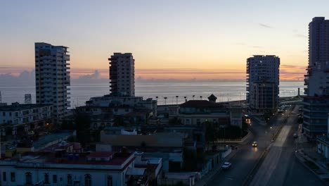 Beautiful-Aerial-Time-lapse-view-of-the-residential-neighborhood-in-the-Havana-City,-Capital-of-Cuba,-during-a-vibrant,-colorful-and-cloudy-sunrise