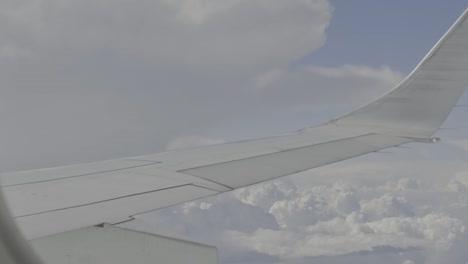 aircraft wing entering dense clouds