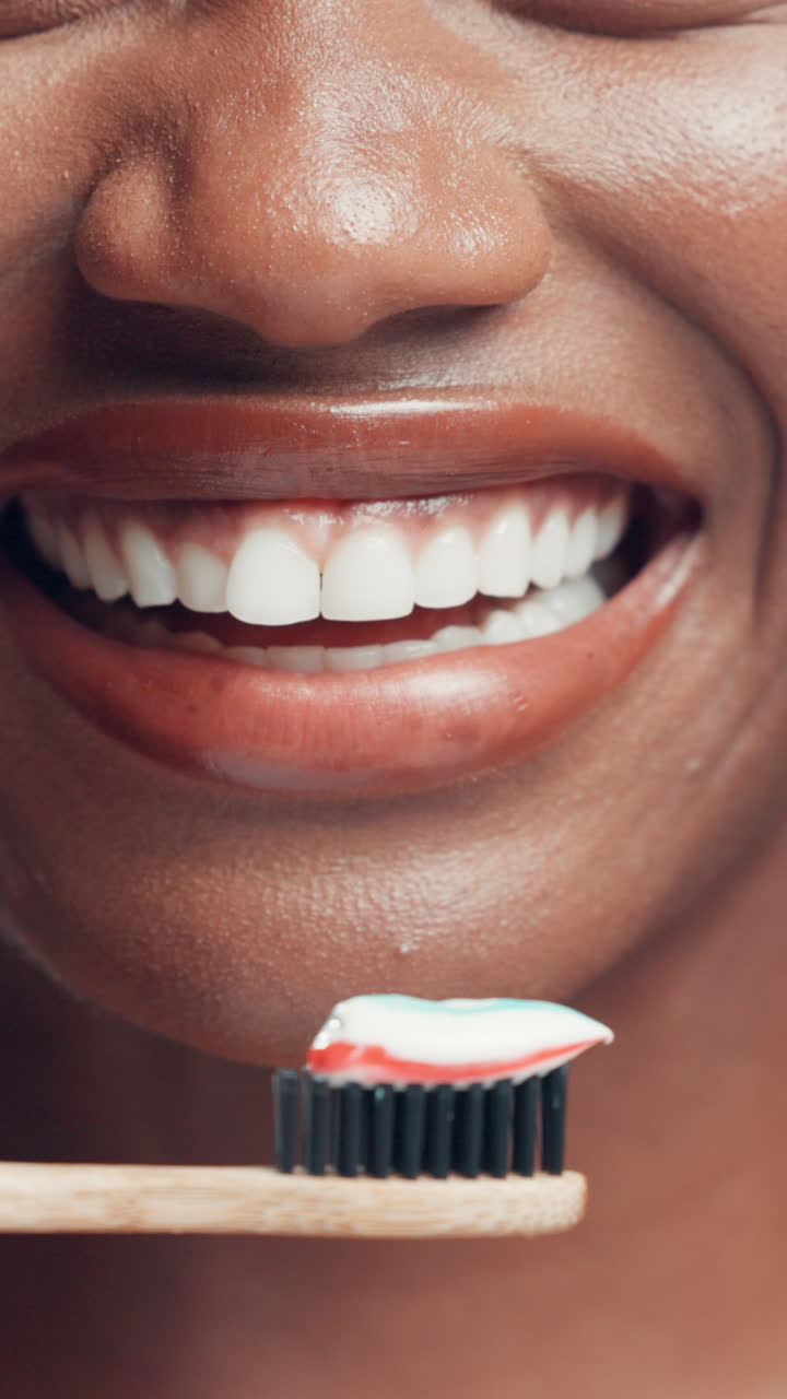 Close-up of a Happy Smile and Toothbrush with Toothpaste