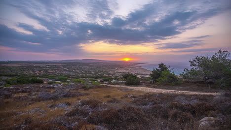 timelapse over a coastline landscape at sunset