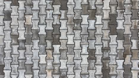 top view of interlocking paving stone texture. outdoor concrete slab pavement high quality drone image