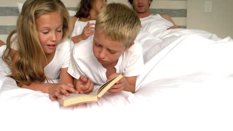 Cute-family-resting-in-their-bed