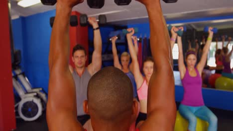 Group-of-people-exercising-with-dumbbell