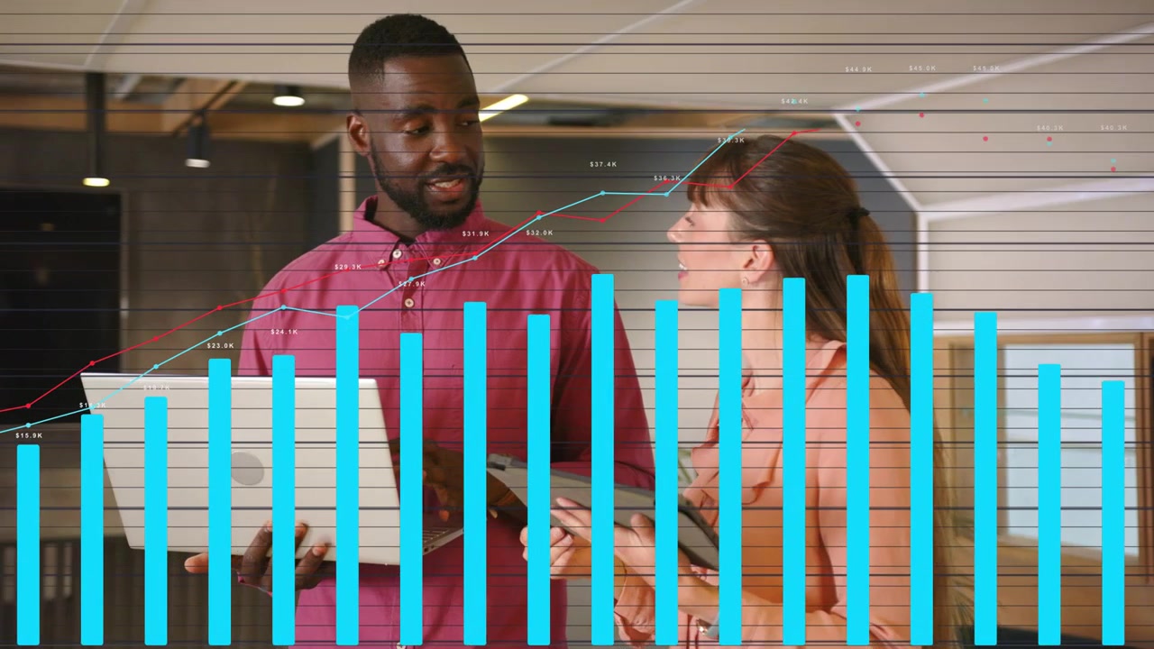 Man and woman reviewing revenue as overlaid REVENUE OVERVIEW bar chart expanding, analyzing trends