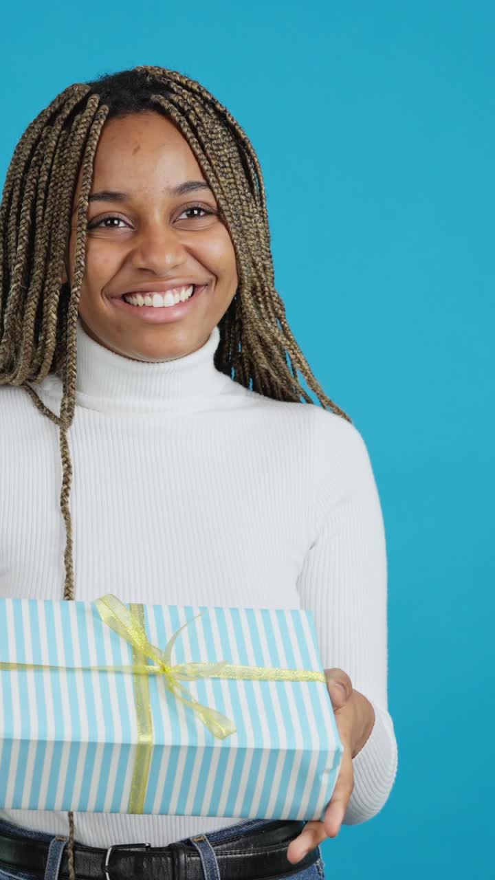 Happy Young Woman Receiving a Gift