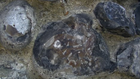 a stone and concrete wall in the suburbs of an english town