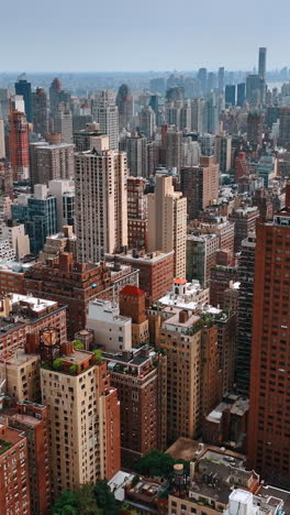 magnificent cityscape of new york at daytime. drone footage above the midtown of metropolis. vertical video