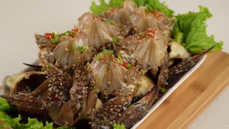 fresh raw crab marinated in soy sauce, enriched with sesame and chili for a savory depth. 신선한 꽃게를 간장에 숙성시켜 감칠맛과 풍미가 살아있는 한 접시.