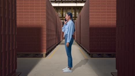 woman in a brick warehouse