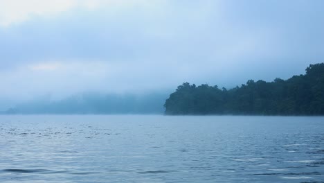 serene lake shrouded in morning mist