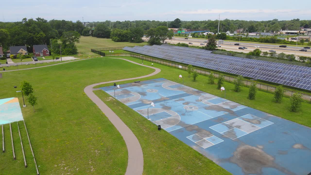 Kids playground and massive solar panel field in Michigan, USA, aerial view