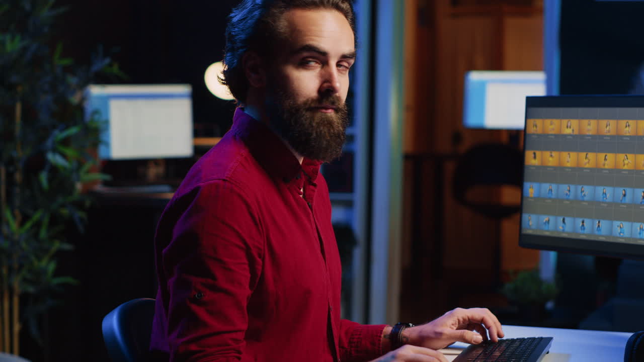 Photo editor retouching photographs with editing software on desktop computer