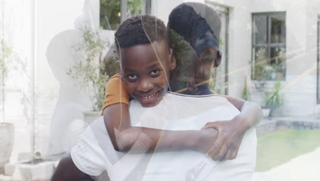 African-American-father-and-son-enjoy-a-camping-snack