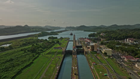 panama city aerial v29 drone flyover industrial attraction miraflores locks with cargo tanker ship on narrow canal waterway, waiting for the sluice gate to open - shot with mavic 3 cine - march 2022