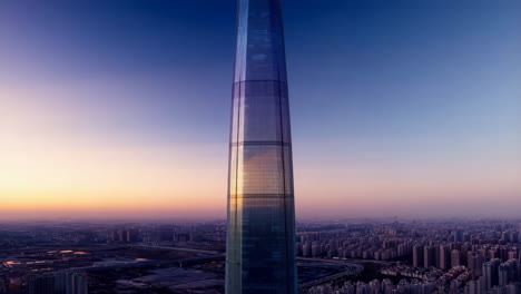 modern skyscraper dominating a vibrant sunset cityscape