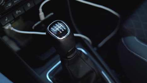 focus on gear knob and interior, panning right