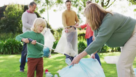 video of smiling caucasian grandson high fiving grandmother while collecting plastic for recycling