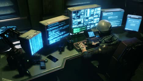 a male hacker surrounded by glowing monitors hacks into someone else's computer network in a dark room of his office. seamless looping animation for fiction, cyber and sci-fi backgrounds.