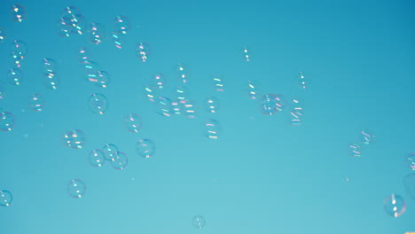 blowing bubbles into the sky