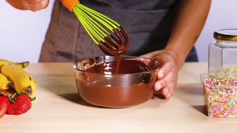 mixing chocolate with bananas and strawberries