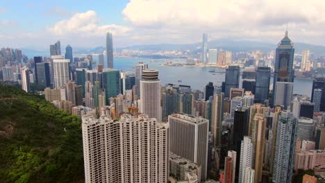 hong kong skyline and skyscrapers overlooking victoria bay on a beautiful day