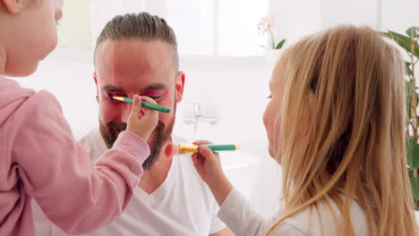 daughter face painting father in bathroom