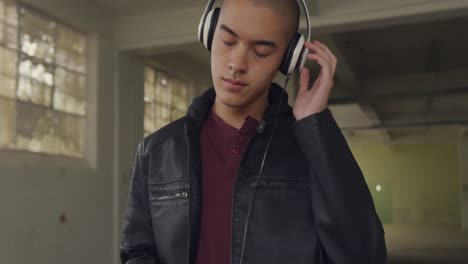 fashionable young man in an abandoned warehouse