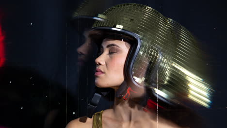 woman poses with mirrorball bunny ears