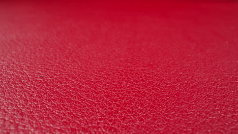 abstract pattern of wrinkles on red cow leather surface