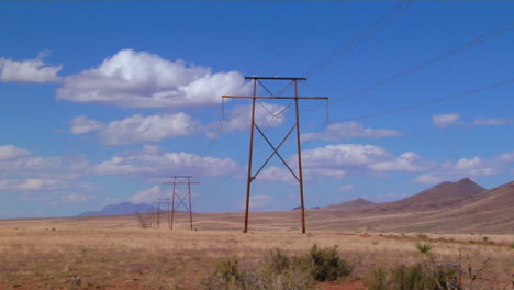 Time-Lapse-Of-Clouds-Moving-Behind-Power-Lines