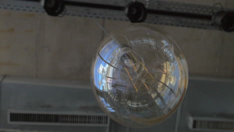 glass orb lamp hanging in the ceiling