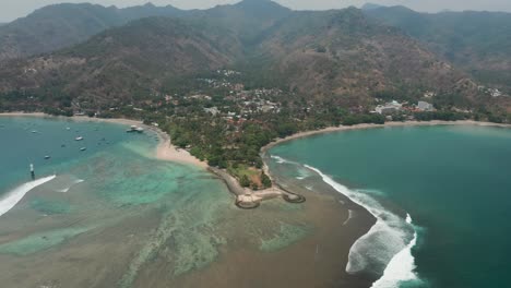 shallow water surrounding tropical shore of lombok at tanjungan pantai senggigi