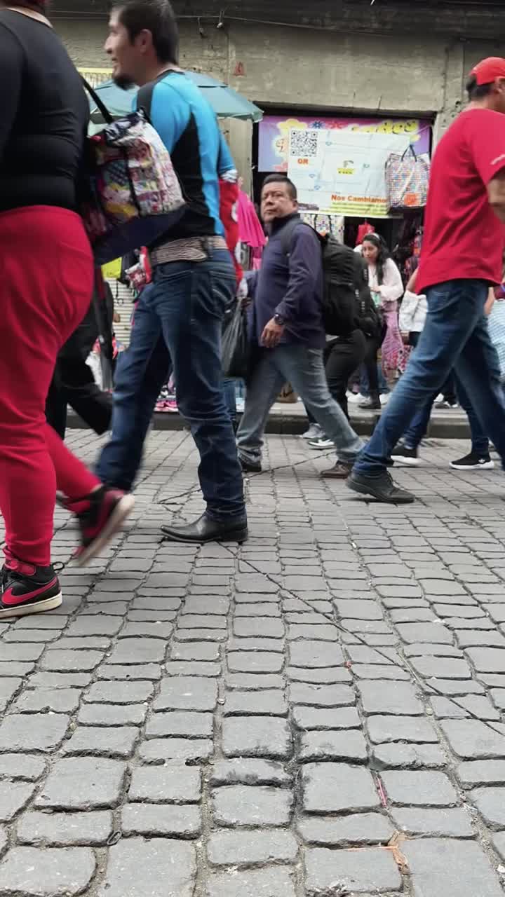 Bustling afternoon timelapse captured on Correo Mayor Street in heart of Mexico City. Vertical shot