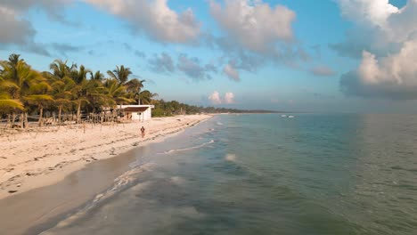 4k aerial flying drone shot of kiwengwa beach washed with turquoise indian ocean waves