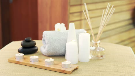 oil, towel, candles and stones