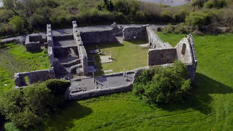 dynamic orbiting shot of annaghdown abbey captures corrib lake and abbey ruins