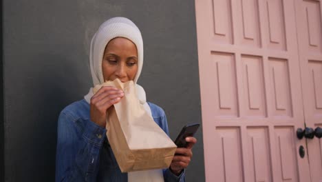 young woman wearing hijab out and about in the city