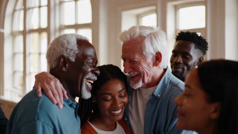diverse multi-generational group shares a joyful embrace