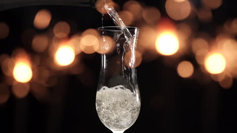 pouring champagne at slow motion in flute with sparklers fireworks lights