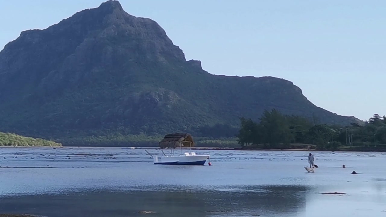 Le Morne seen in the far distance of a sea side shot in Mauritius.